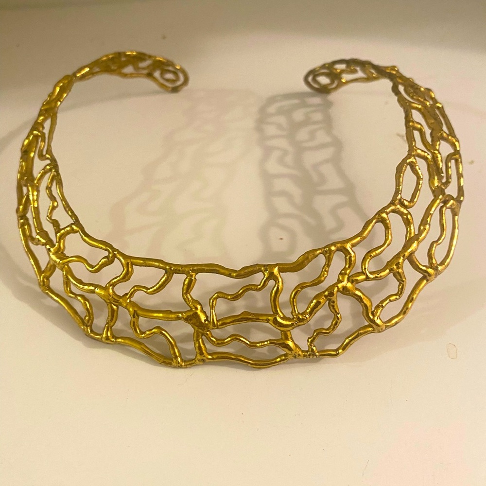 Shiny brass-like filigree collar